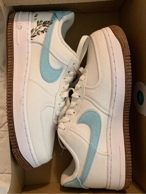 Nike White Canvas Sneakers with Light Blue Swoosh and Brown Gum Outsole